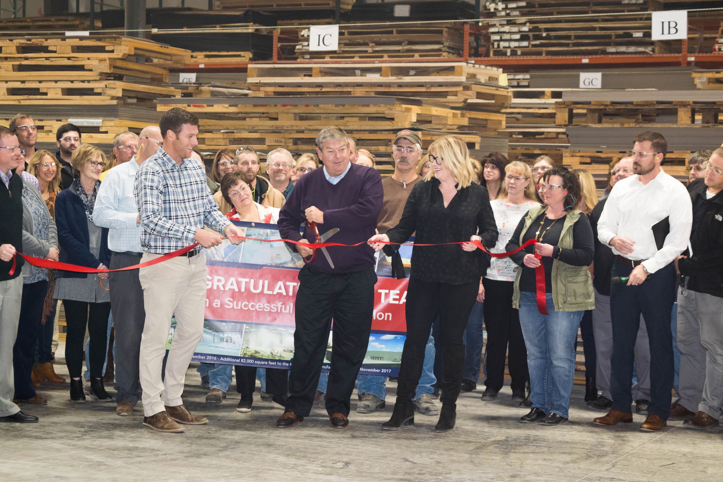 President & CEO, Doug Clausen cuts the ribbon.