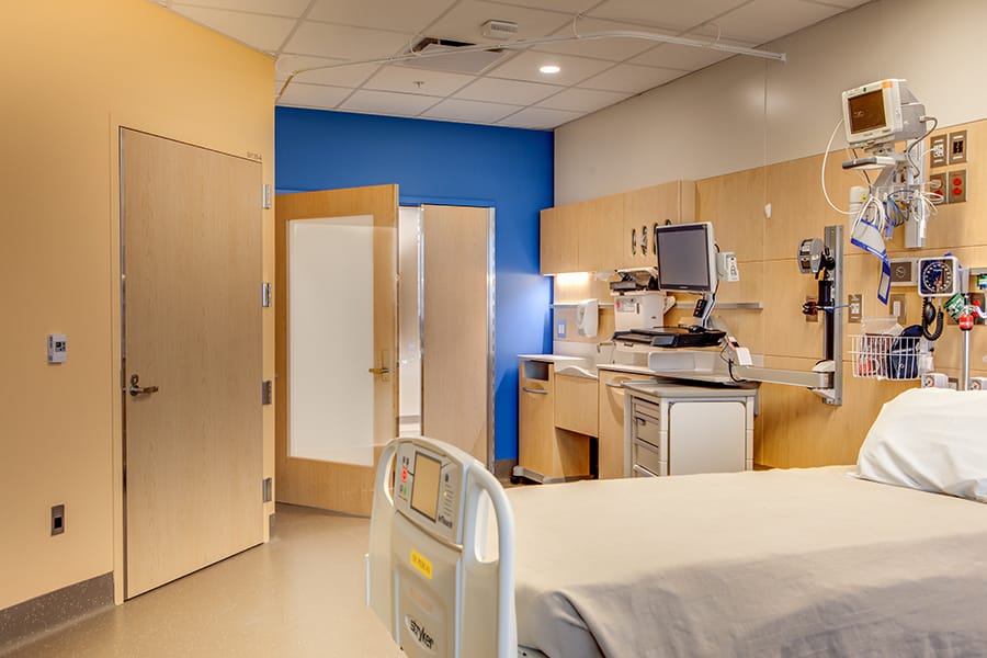VT Industries High Pressure Decorative Laminate doors shown in a patient room