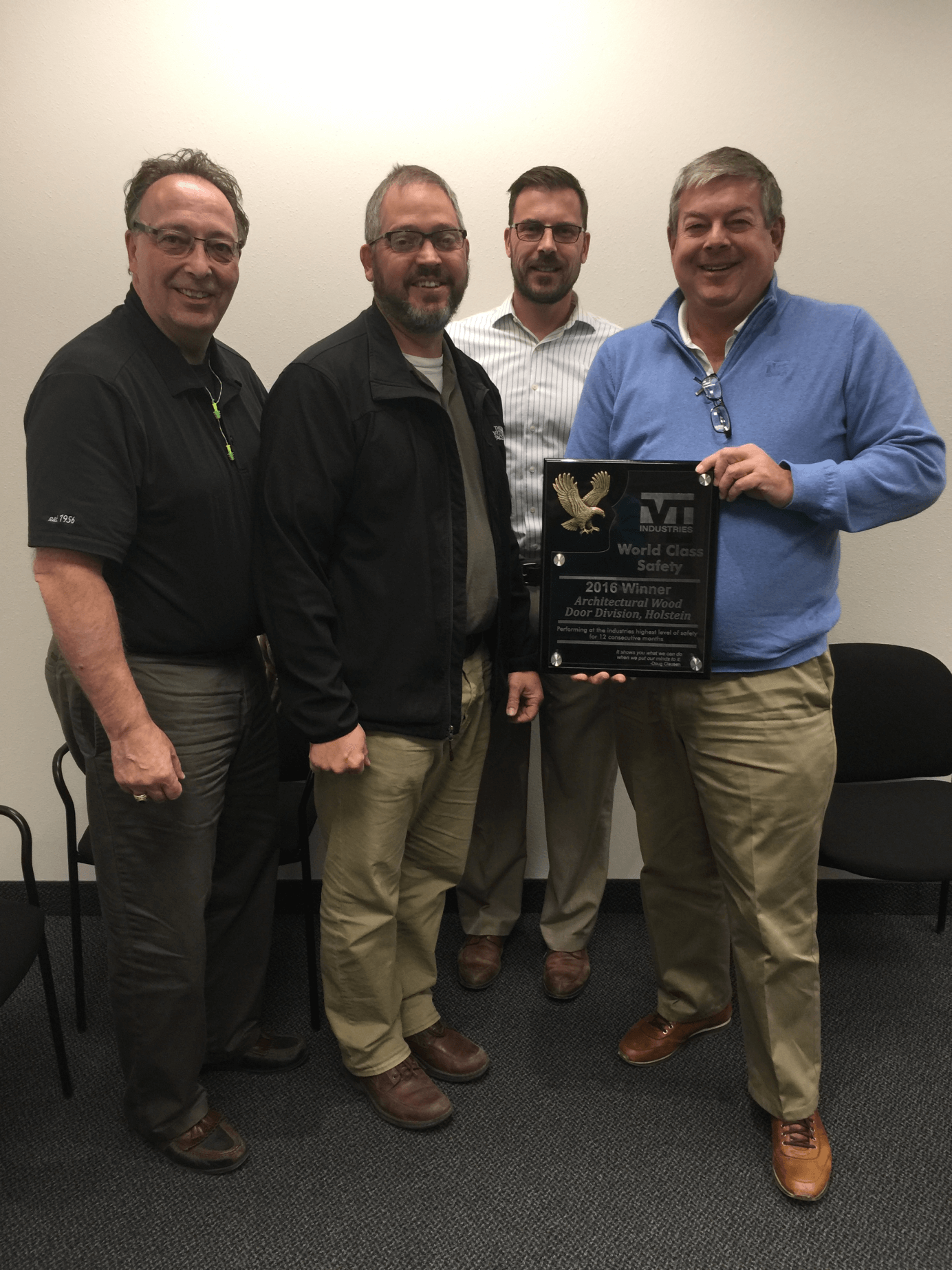 Doug Clausen and Jason Farver present the award.